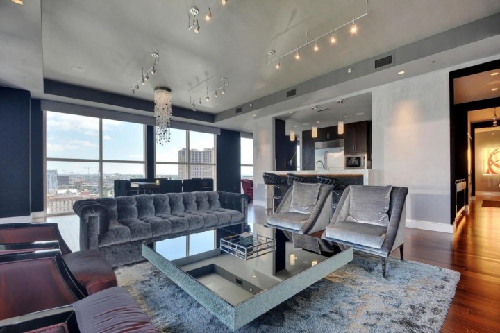 A living room with couches and tables in it