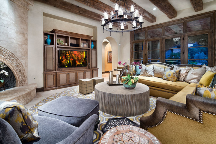 A living room with lots of furniture and a large tv.