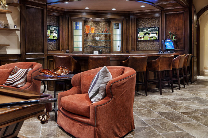 A living room with a bar and chairs
