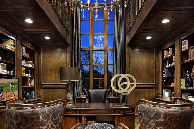 A library with two chairs and a table