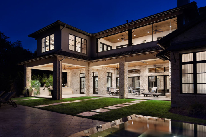 A large house with a pool and patio area.