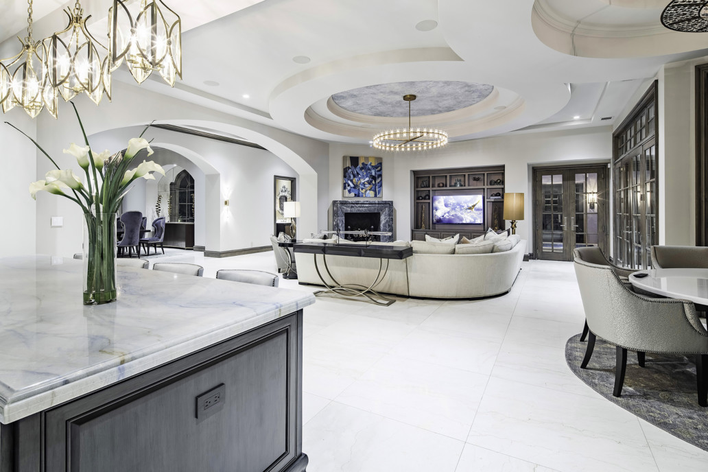 A large room with white walls and marble floors.