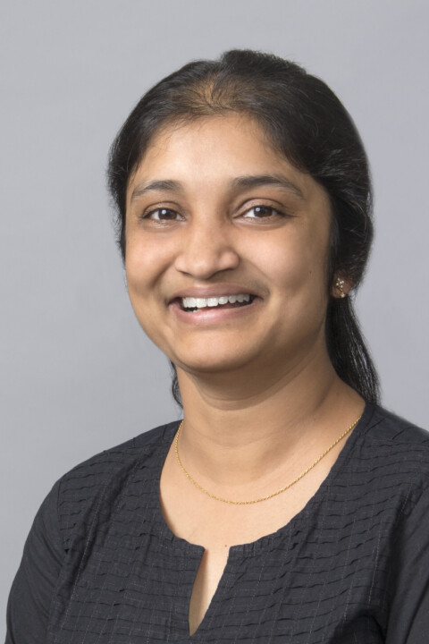 A woman with long hair and a black shirt