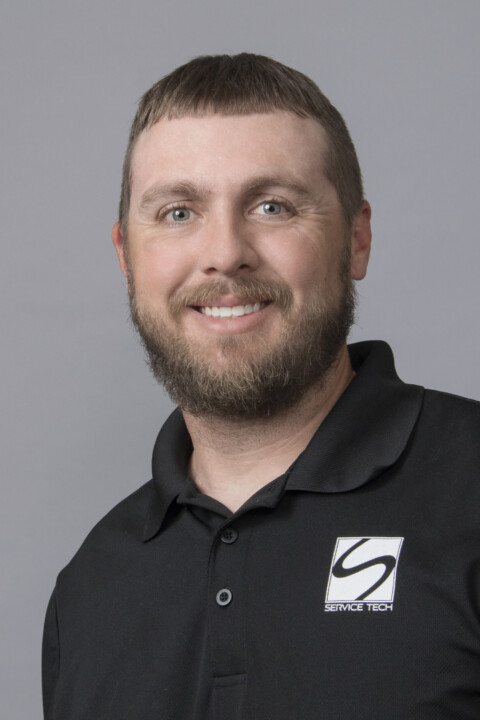 A man with a beard wearing a black shirt